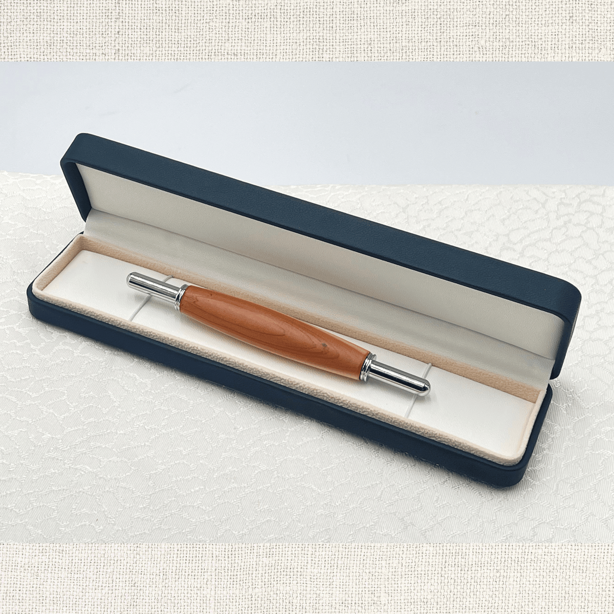 Handcrafted wooden seam ripper presented in an elegant black gift box
