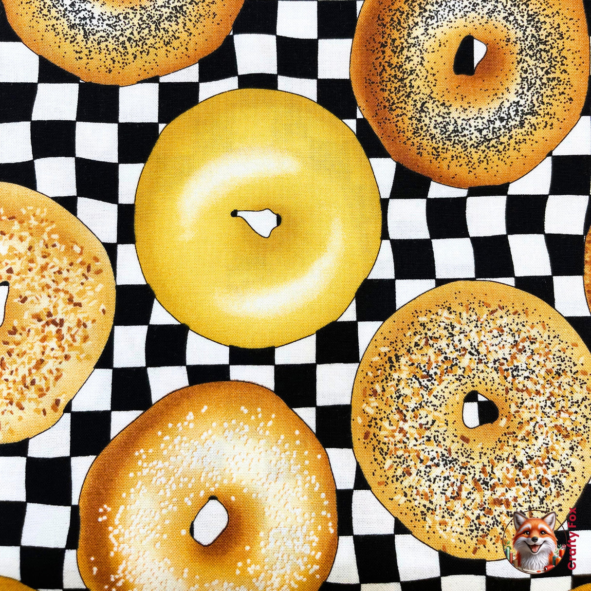 Caramel iced Bagel in the centre of photograph and is surrounded with other variety of bagels, category for Food Drink, this is Quilting, Cotton, Novelty Fabric, by Timeless Treasures Fabrics - Fabric Code TT-GM.C6003