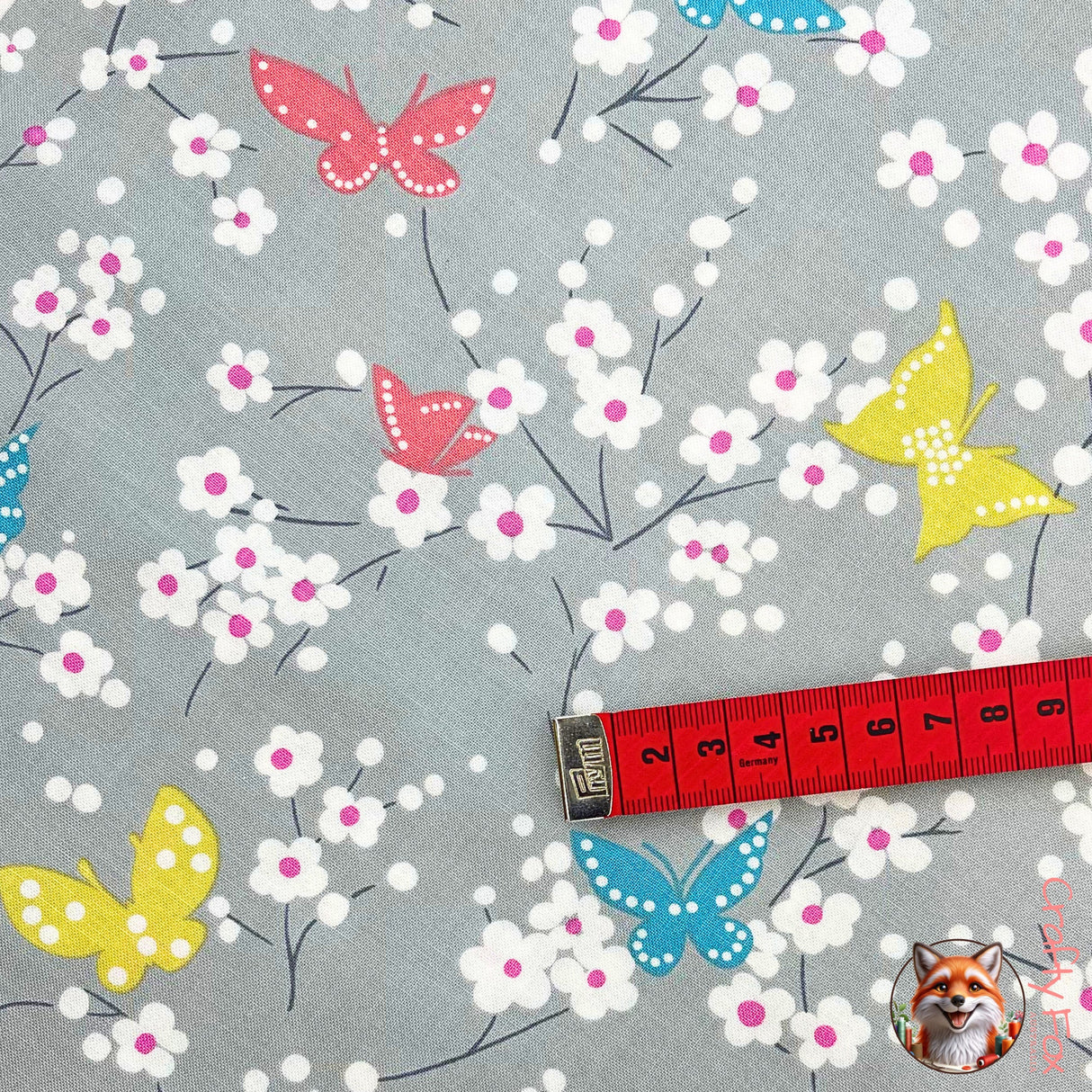 Measuring tape showing measurements of Blue Butterfly on fabric, Michael Miller