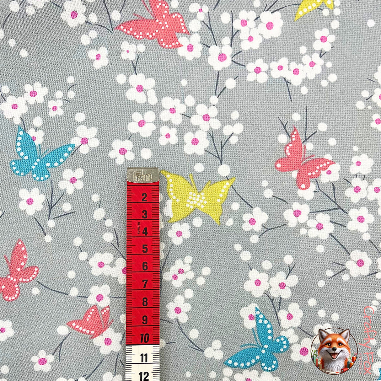 Vertical view of measuring tape showing measurements of Yellow Butterfly on fabric