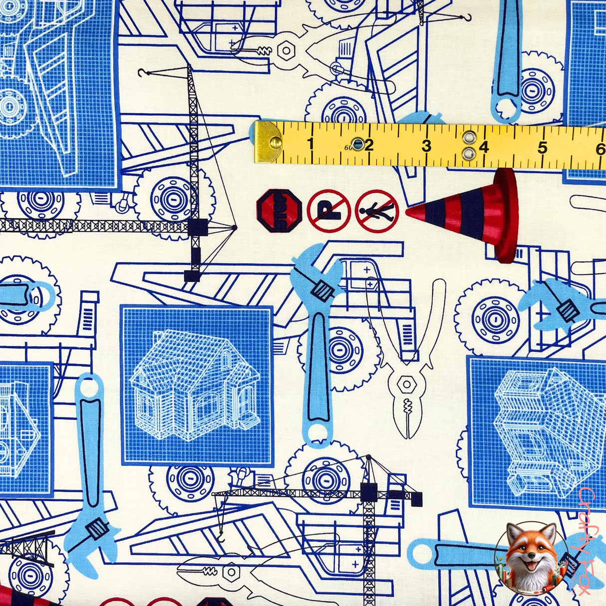 Tape measure in yellow showing Under Construction fabric, Mining, rare fabric by Benartex Kanvas BT05891.09