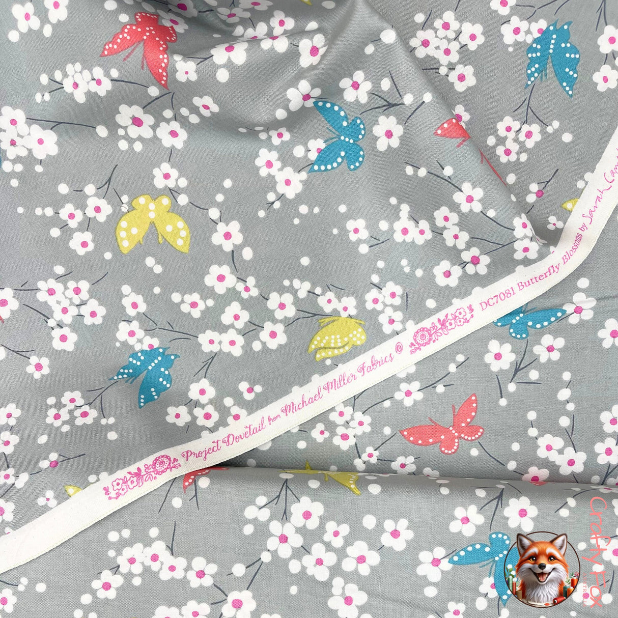 View of selvage tape in white identifying it be Michael Miller fabric