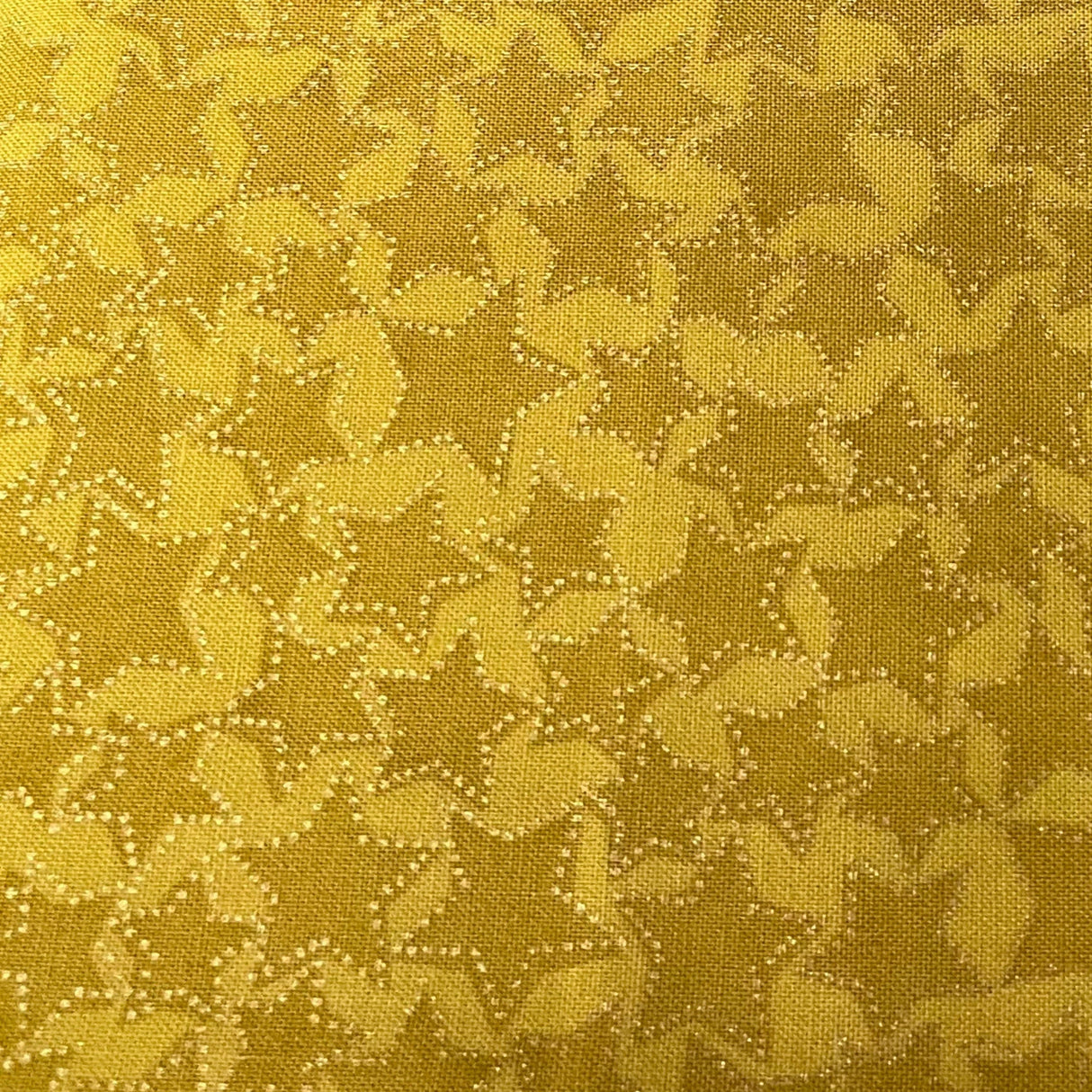 Close up of Catching Dreams Fabric, Cotton Quilting Golden Stars Fabric by Michael Miller Fabrics