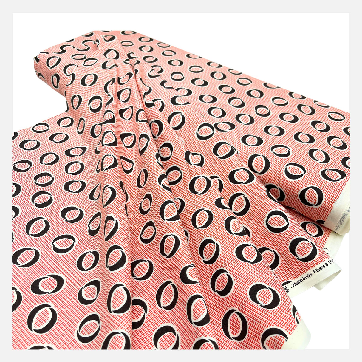 Folded fabric of Calligraphy Circle, Black, Carnelian Orange Cotton Quilting fabric