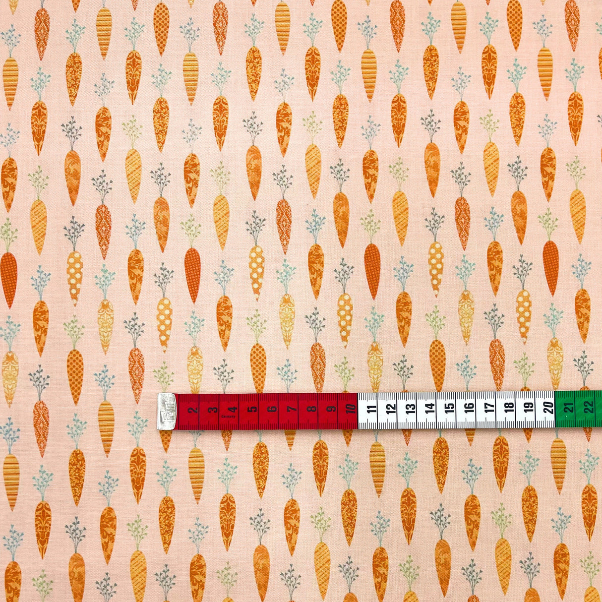 Bunny Tales Fabric with Carrots on Soft Peach - Lucie Crovatto Design