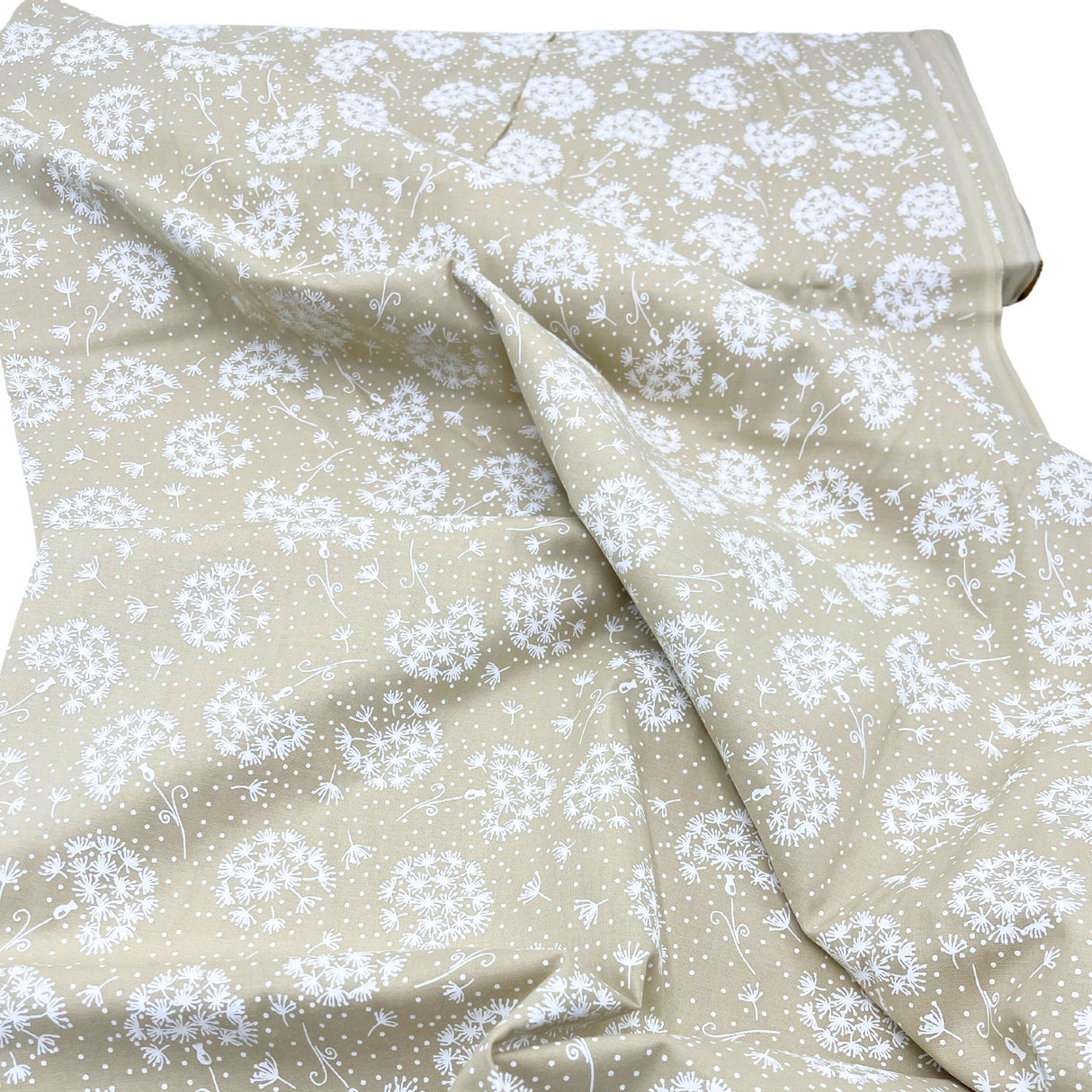 Folded fabric of Tone on Tone by SewTrade: Essential Dandelions Quilting Cotton