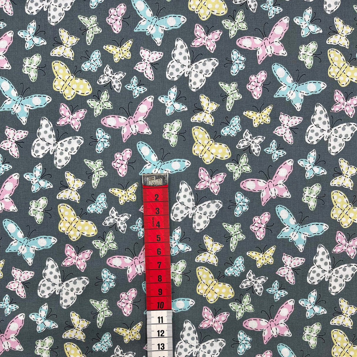 Butterfly Folly Fabric: Multi-Coloured Butterflies on Charcoal - Michael Miller