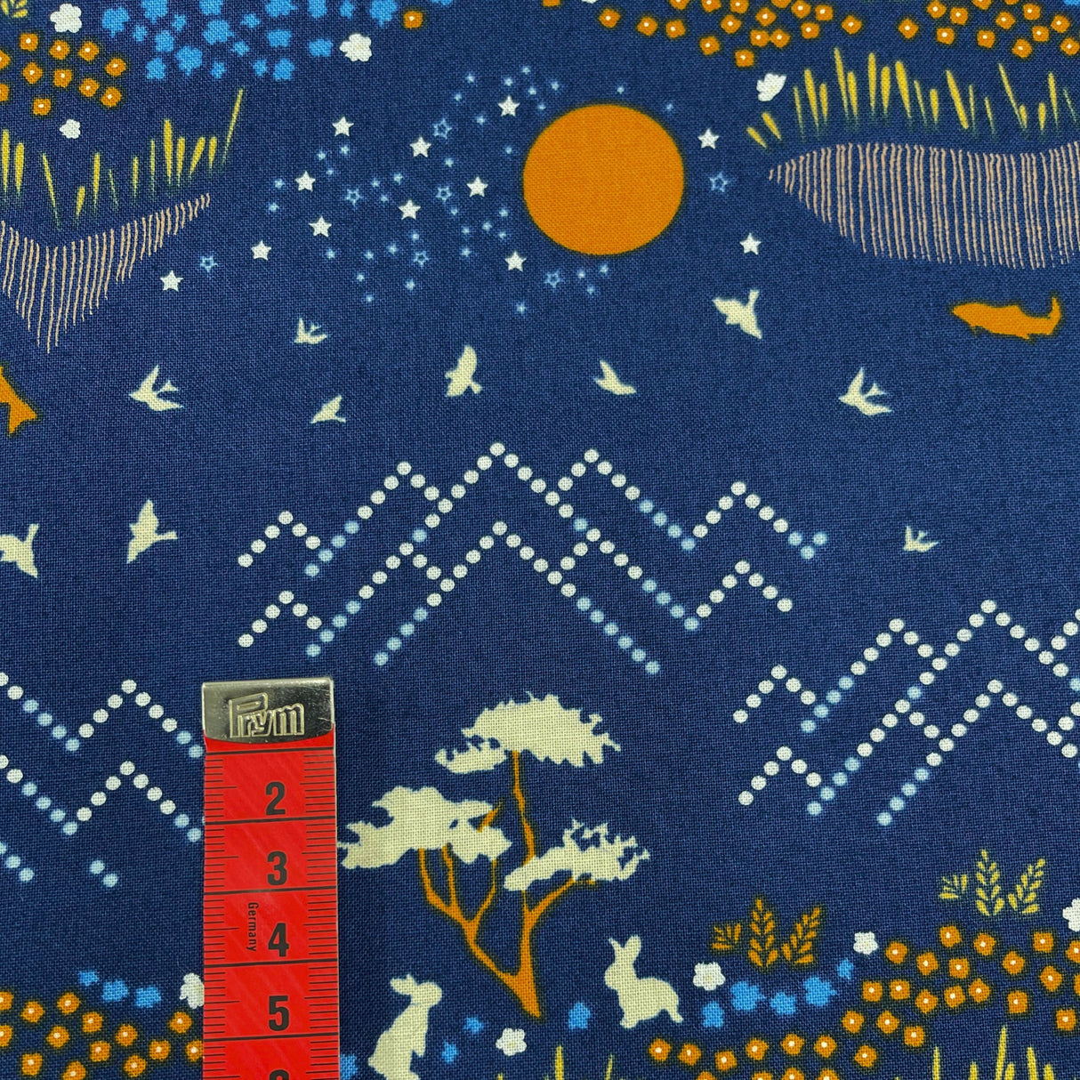 red tape measure showing height of mountains