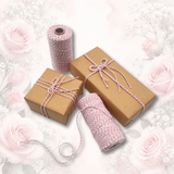 Pink baker’s twine with natural kraft gift wrapping paper and wrapped gifts