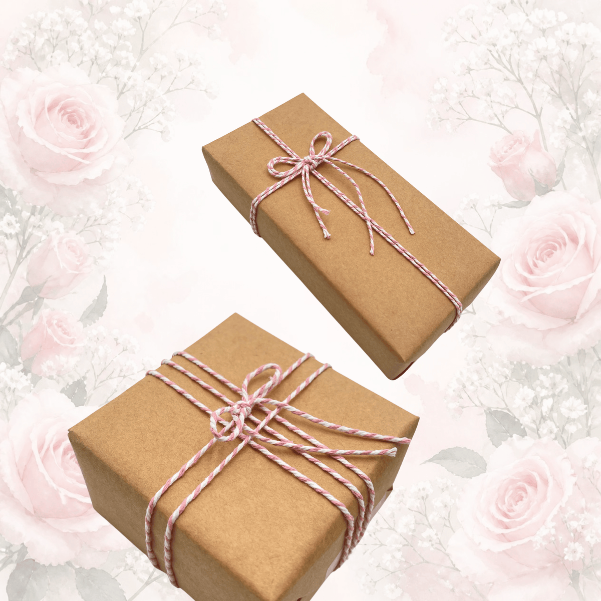 Two brown kraft paper gift boxes wrapped with pink and white twisted twine and tied with bows, set against a soft white background decorated with light pink roses.