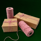 Natural kraft gifts wrapped with red and white cotton baker’s twine