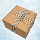 French Blue baker’s twine tied around natural kraft gift wrapping paper