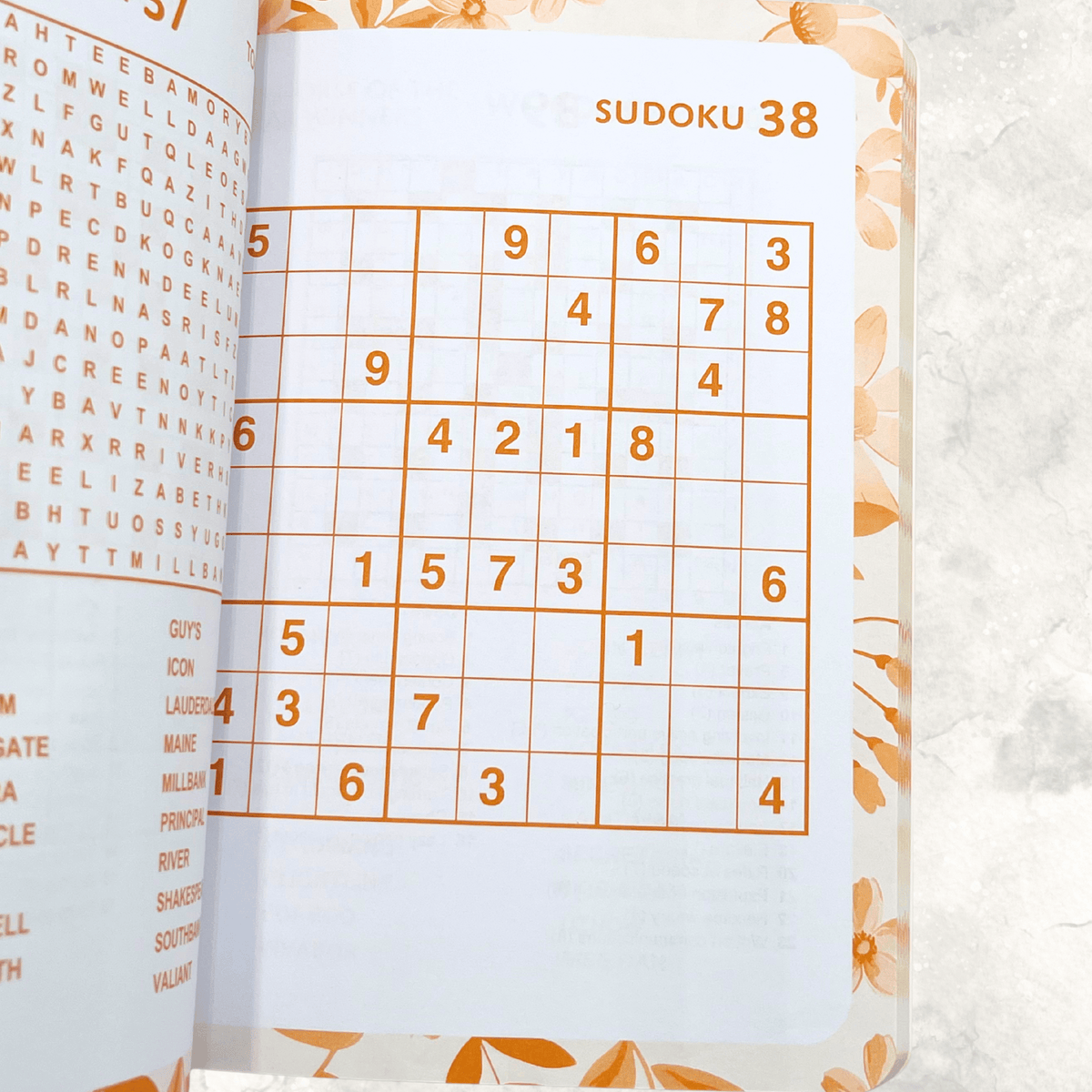 Sudoku number puzzles inside the floral Mixed Puzzle Book for relaxing brain-teasing entertainment