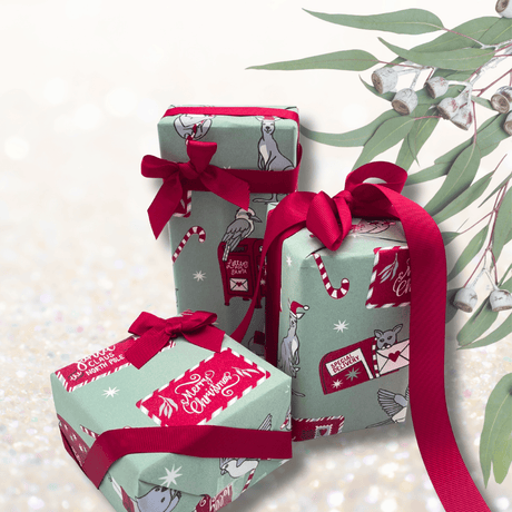 Australian Christmas wrapping paper styled with Scarlet Red grosgrain ribbon