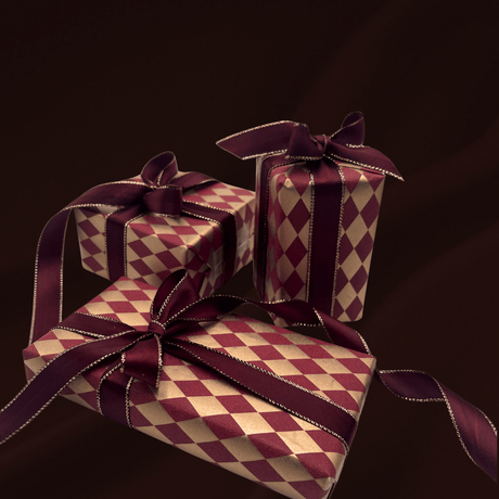 Gold and burgundy diamond Christmas gift wrapping paper with burgundy satin ribbon