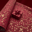 Harvest Burgundy gift wrapping paper with golden acorns, berries and burgundy satin ribbon