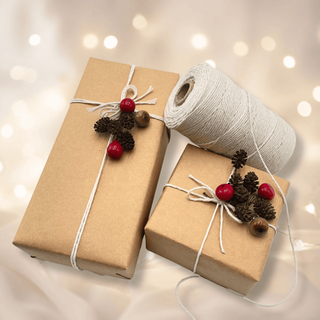 Taupe baker’s twine with natural kraft gift wrapping paper and Christmas embellishments
