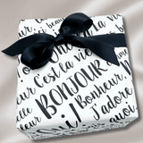 Gift wrapped in Paris pearlised wrapping paper with elegant black French lettering and a coordinating black satin ribbon bow.