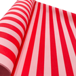 Close-up of Pavilion Poppy red and pink striped Christmas gift wrapping paper showing the bold stripe design and matte finish