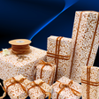 Floral Posy Toffee rustic gift wrapping paper with amber velvet ribbon and wrapped gifts
