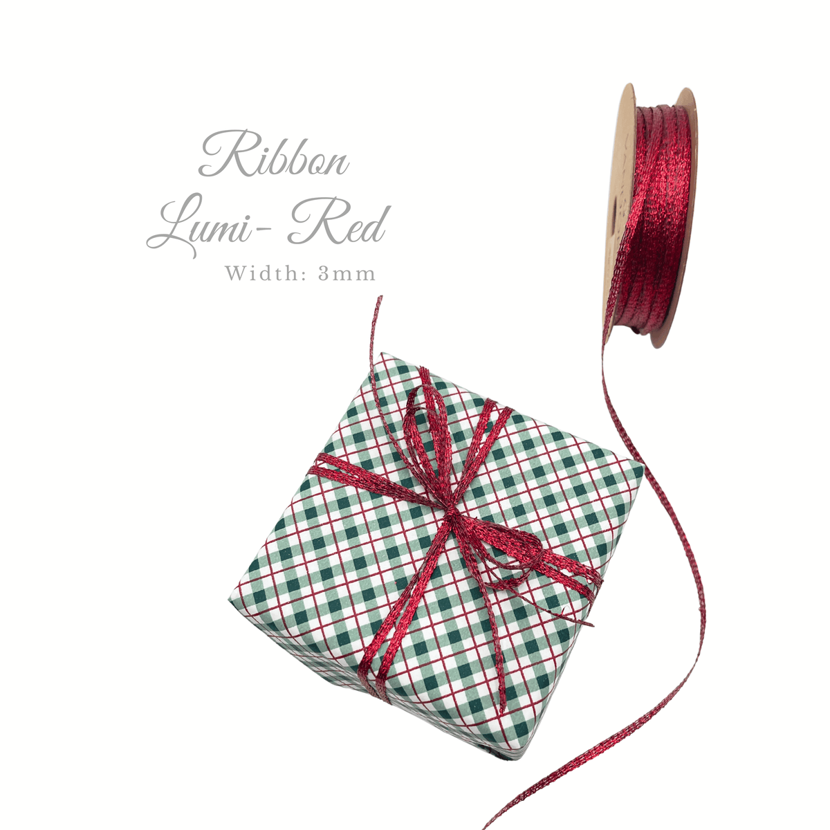 Red metallic 3mm ribbon tied around festive checked Christmas gift wrap