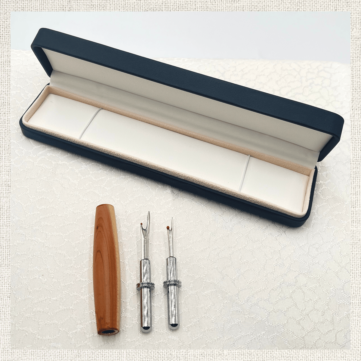 Wooden seam ripper with interchangeable blades and black presentation gift box
