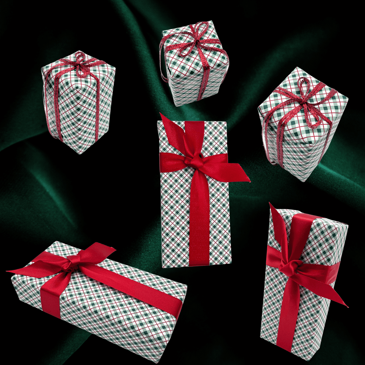 Five wrapped gift boxes arranged on a dark green satin background. The boxes are wrapped in white paper with a red and green plaid pattern and tied with red ribbon bows.