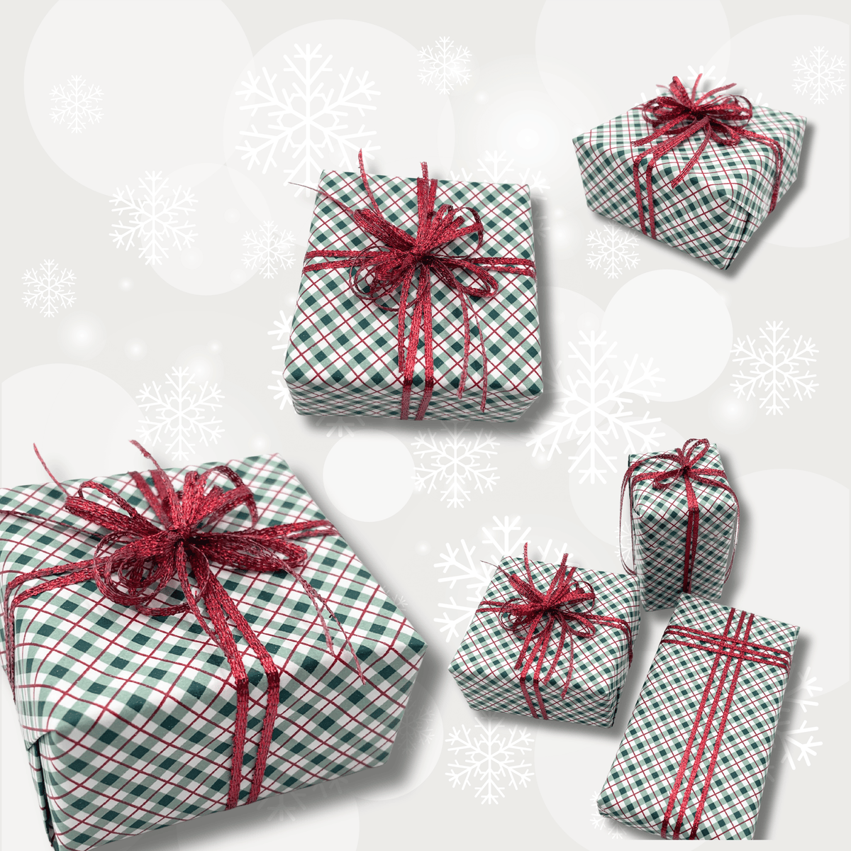 Five wrapped gift boxes arranged on a light gray background with white snowflake graphics. The boxes are covered in green and white plaid wrapping paper and tied with red glittery ribbon bows.