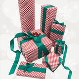 A collection of wrapped Christmas presents in red and white gingham pattern with dark green ribbon bows and ties, arranged on a light gray background with white snowflakes.