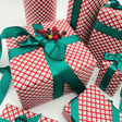 Red green and white check Christmas wrapping paper with Evergreen ribbon
