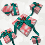 Yuletide Red Christmas gift wrap styled on assorted gift boxes with green ribbon
