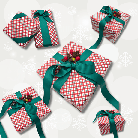 Yuletide Red Christmas gift wrap styled on assorted gift boxes with green ribbon