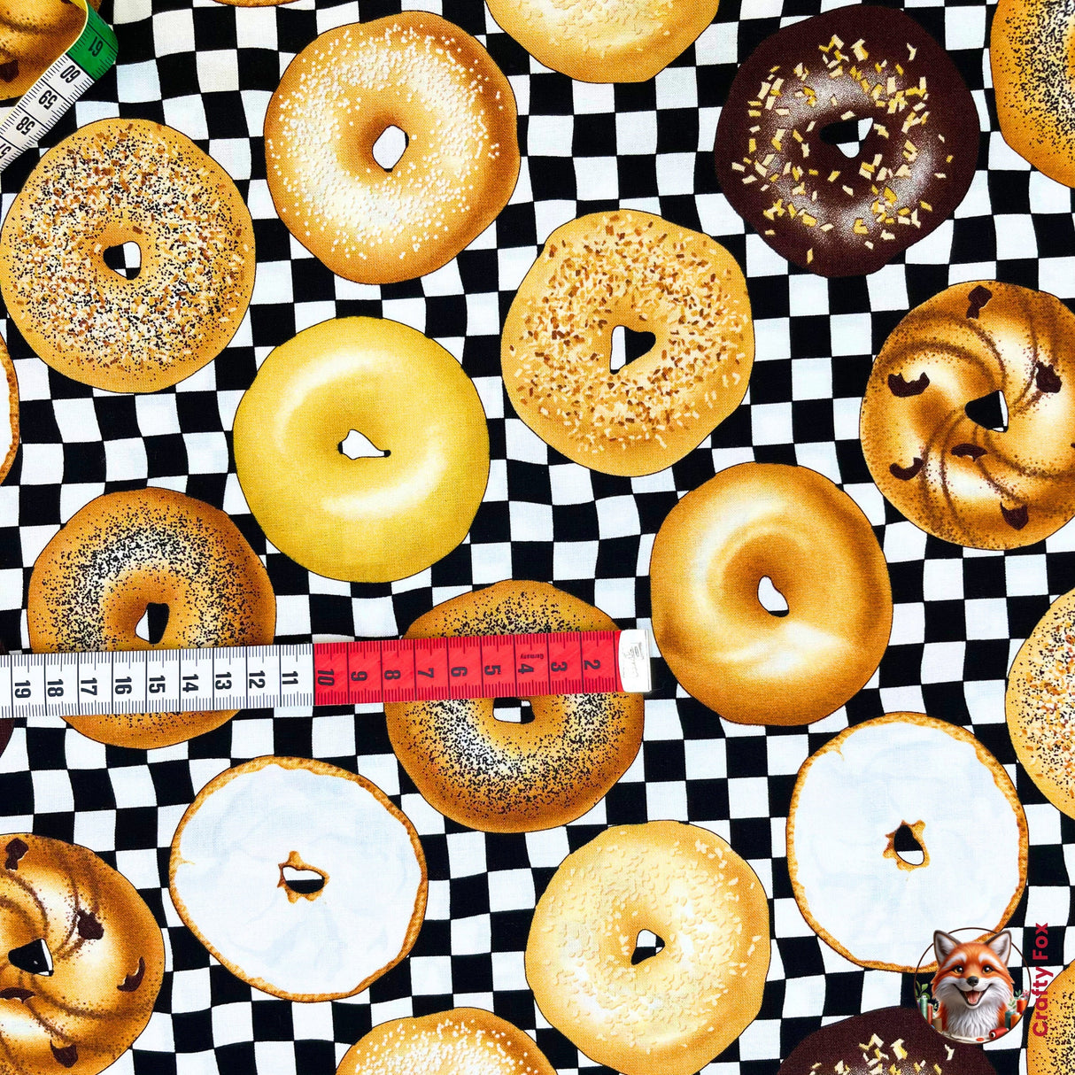 Horizontal measurement of Bagel fabric, showing a variety of bagels. Category for Food Drink, this is Quilting, Cotton, Novelty Fabric, by Timeless Treasures Fabrics - Fabric Code TT-GM.C6003