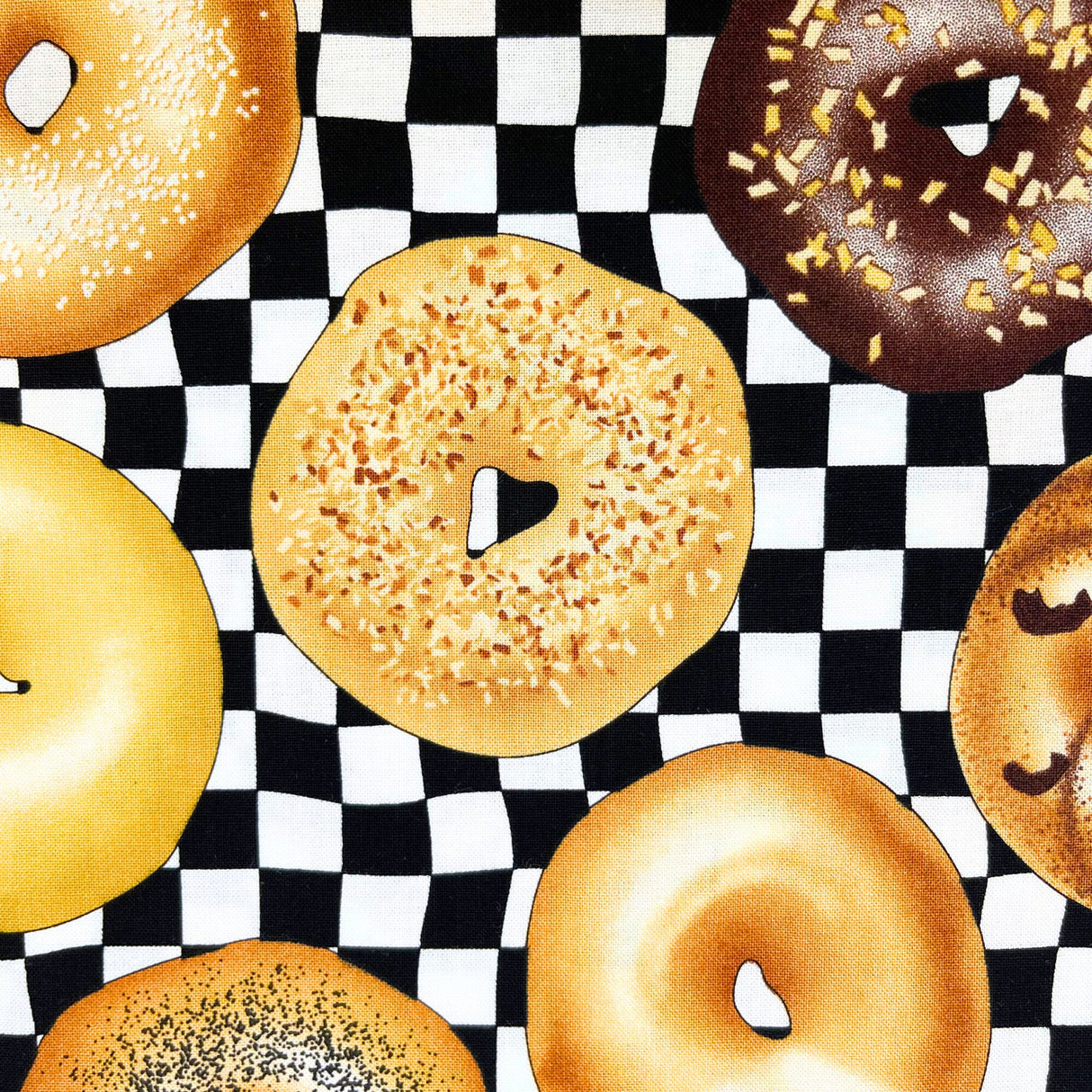 Bagel sprinkled with ham and cheese for its topping and is surrounded with other variety of bagels, category for Food Drink, this is Quilting, Cotton, Novelty Fabric, by Timeless Treasures Fabrics - Fabric Code TT-GM.C6003