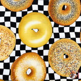 Caramel iced Bagel in the centre of photograph and is surrounded with other variety of bagels, category for Food Drink, this is Quilting, Cotton, Novelty Fabric, by Timeless Treasures Fabrics - Fabric Code TT-GM.C6003