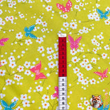 Measuring tape showing size of Pink Butterfly of Butterfly Blossom on a lime green background