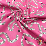 Swirl of fabric Sew! Sew! TapeMeasures on Pink Cotton fabric, Benartex BT8467.22