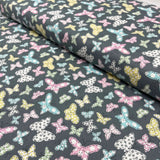 Butterfly Folly Fabric: Multi-Coloured Butterflies on Charcoal - Michael Miller