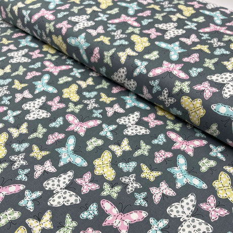 Butterfly Folly Fabric: Multi-Coloured Butterflies on Charcoal - Michael Miller
