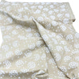 Folded fabric of Tone on Tone by SewTrade: Essential Dandelions Quilting Cotton