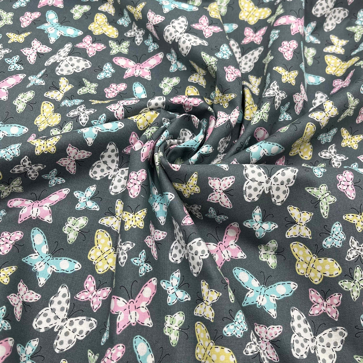 Butterfly Folly Fabric: Multi-Coloured Butterflies on Charcoal - Michael Miller