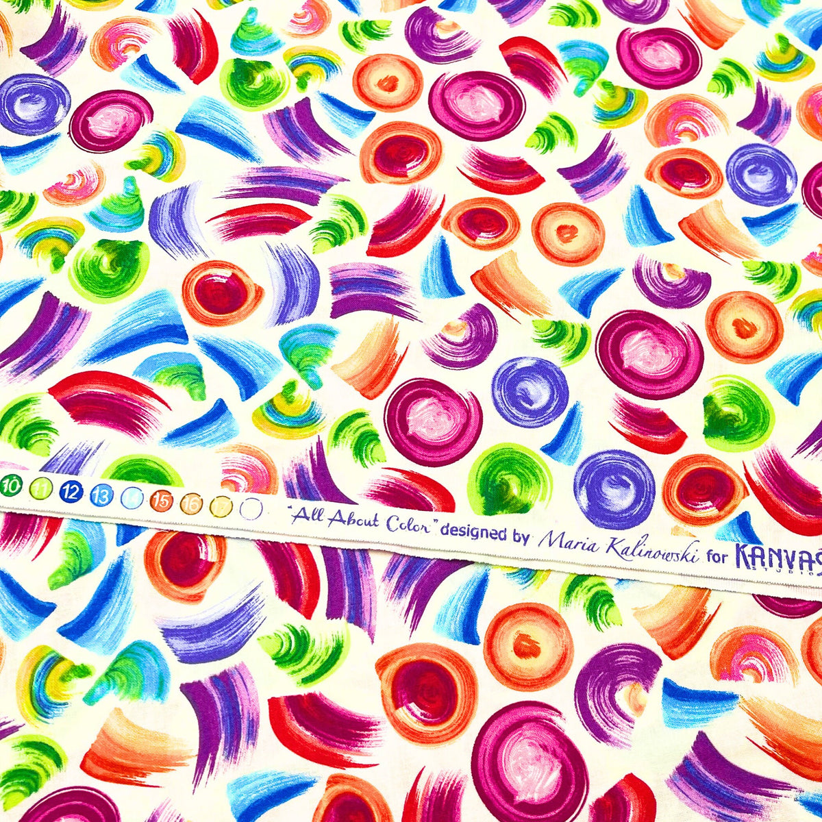 Selvage showing designer for All About Color, Cotton Quilting fabric, multi colour brush strokes on Cream background, BT8669-09